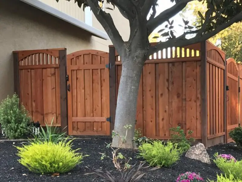 Arched redwood craftsman fence