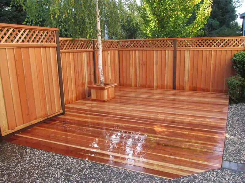 Redwood patio with decorative redwood fence