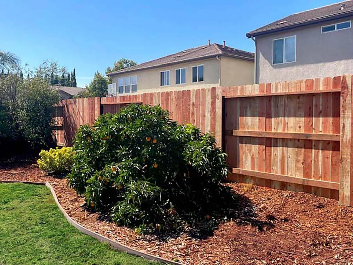 Redwood patio with decorative redwood fence