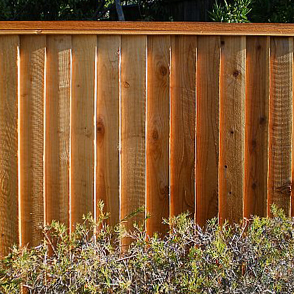 Redwood fence with cap and trim