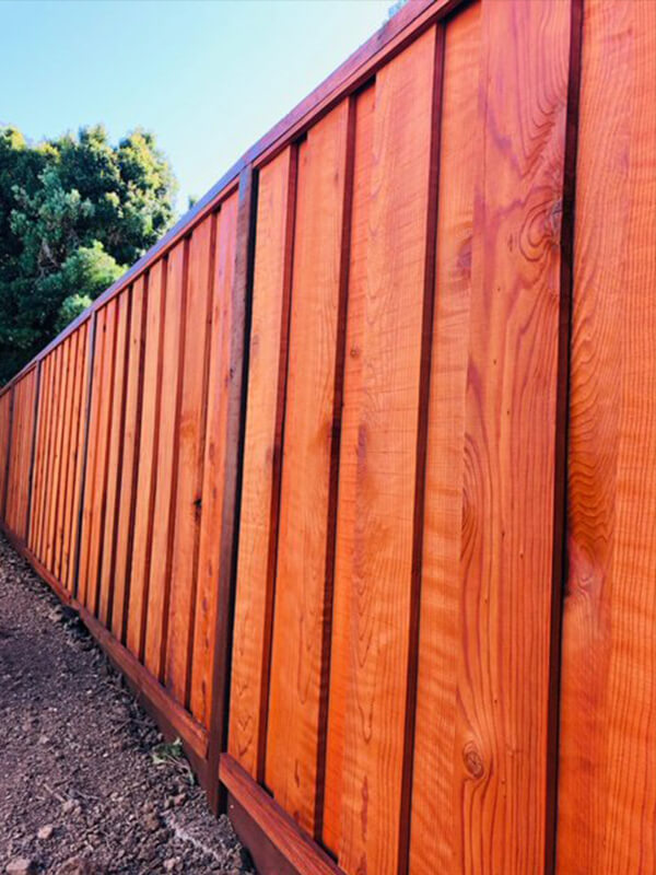 Decorative redwood fence installed in Colorado