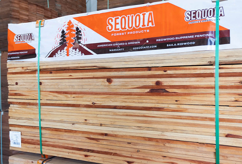 Redwood fence boards stacked in Home Depot