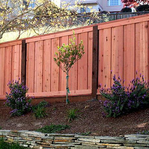 Beautiful board on board cap and trim redwood fence