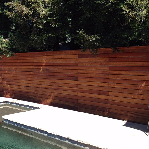 Redwood pool fence with horizontal fence boards