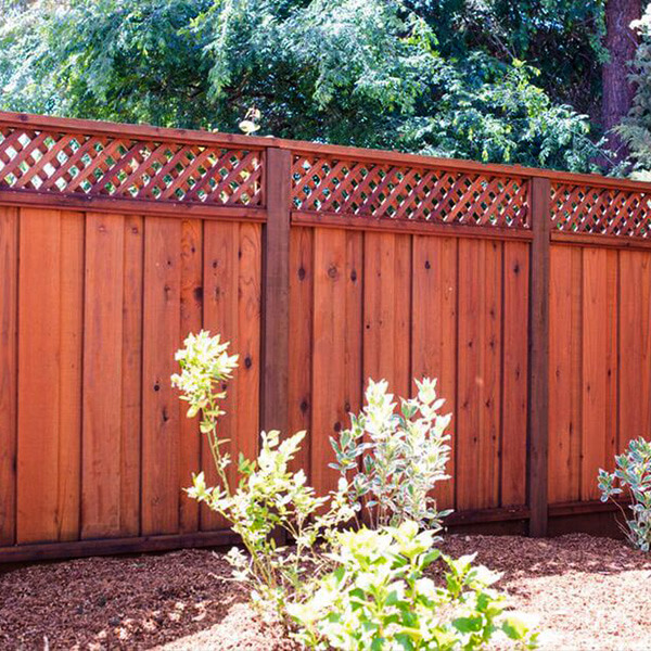 Redwood lumber lattice top fence